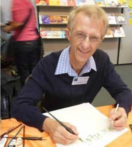 Peter Taylor demonstrating his art at the Bologna Children's Book Fair